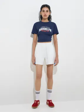 Buy Studiofit White Solid High-Rise Shorts from Westside