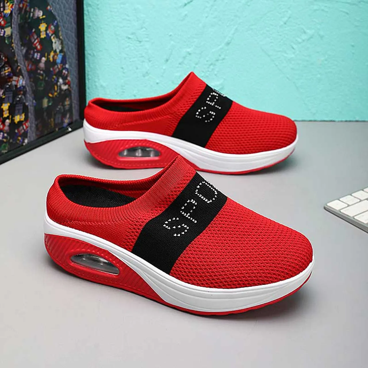 Red flyknit sport pattern slip on rocker bottom shoe mule